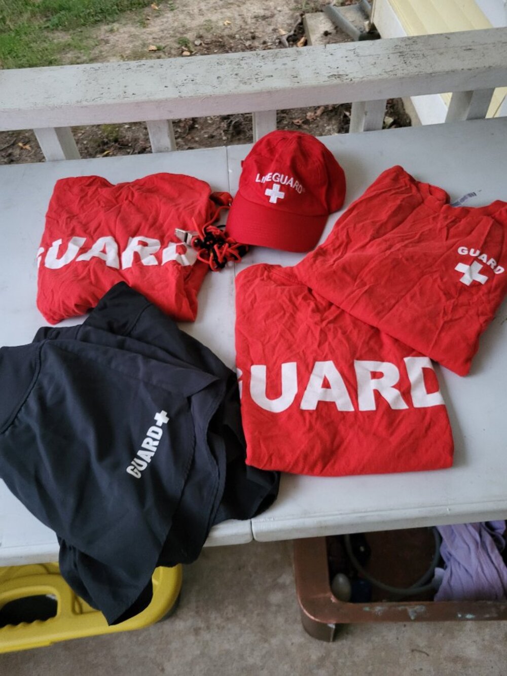 Lifeguard shorts hat whistles and shirts